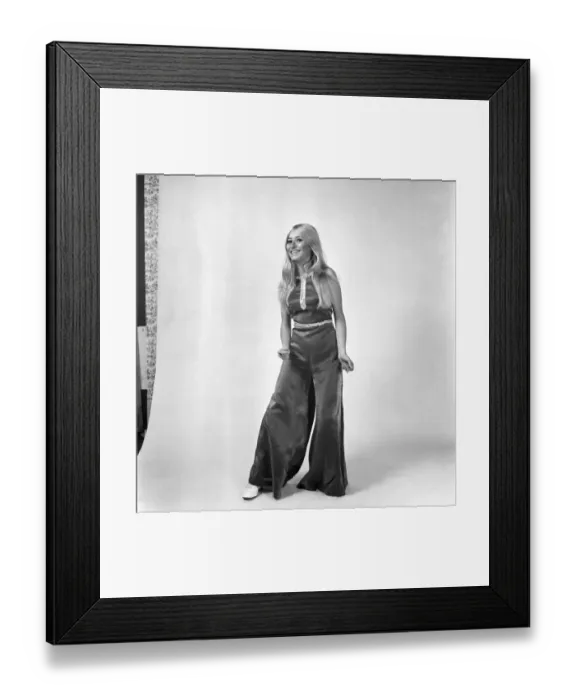 Framed Print : Eva Haraldsted, ex-girl friend of soccer star George Best wears a shimmering black Framed Print : Eva Haraldsted, ex-girl friend of soccer star George Best wears a shimmering black