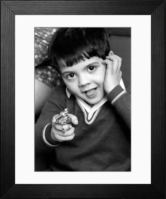 Framed Print : Little abandoned boy who calls himself George Mason settles down in a children Framed Print : Little abandoned boy who calls himself George Mason settles down in a children