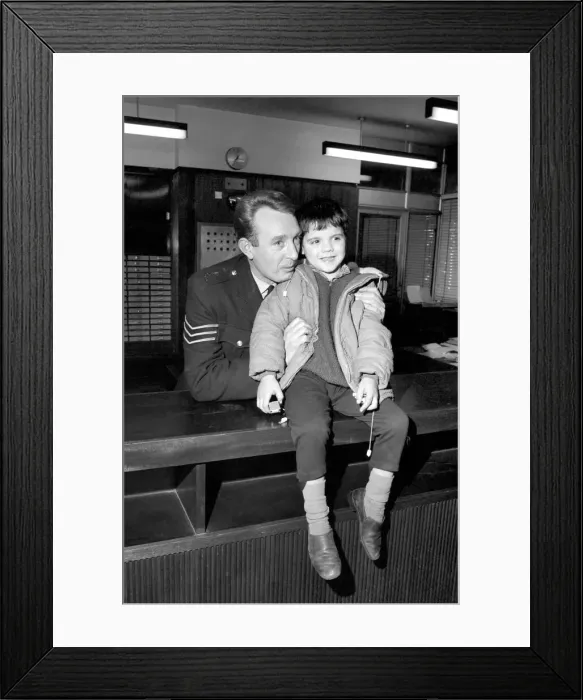 Framed Print : Children with policemen: A six year old boy who calls himself George Mason is Framed Print : Children with policemen: A six year old boy who calls himself George Mason is