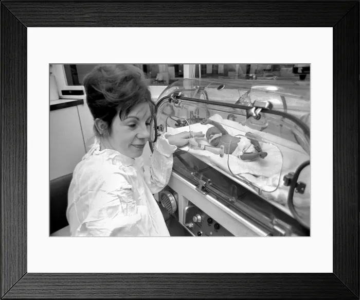 Framed Print : Medical. Mrs. Rosemary Letts holds baby Cara for the first time in the incubator