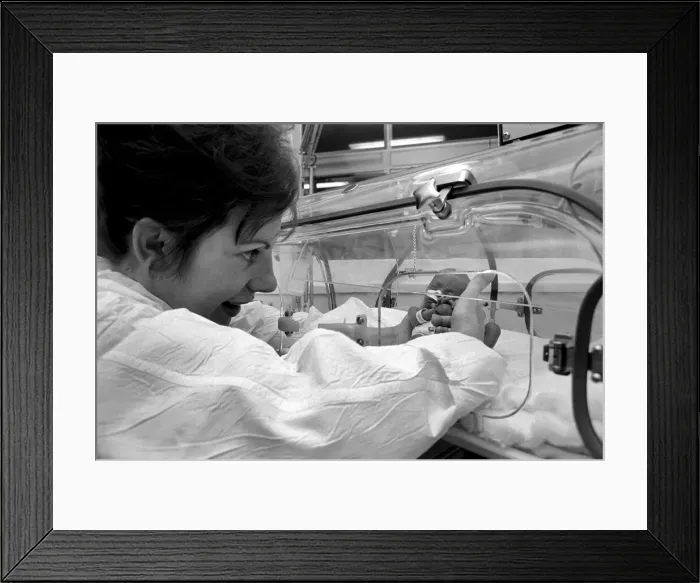 Framed Print : Medical. Mrs. Rosemary Letts holds baby Cara for the first time in the incubator Framed Print : Medical. Mrs. Rosemary Letts holds baby Cara for the first time in the incubator