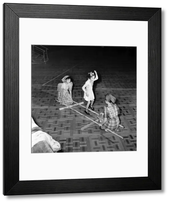 Framed Print : Entertainment: Dance: Folk Dancing. In this dance from the Phillipine Islands called Framed Print : Entertainment: Dance: Folk Dancing. In this dance from the Phillipine Islands called