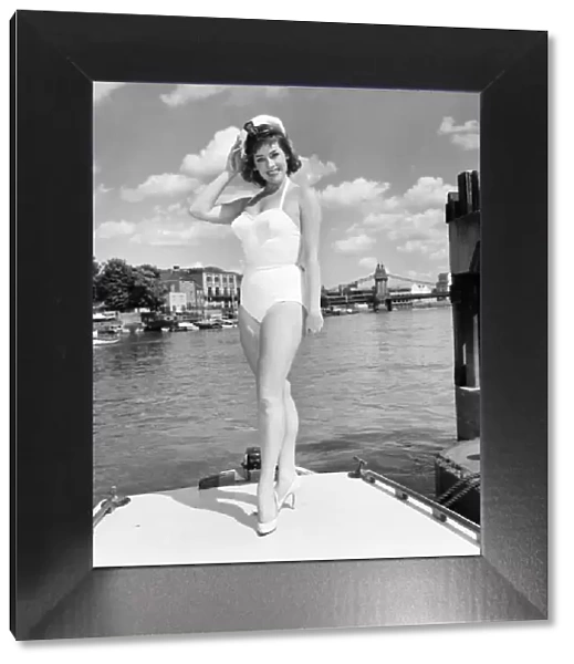 Glamour girl  /  actress June Barry at Hammersmith Pier. June 1960 M4372-009