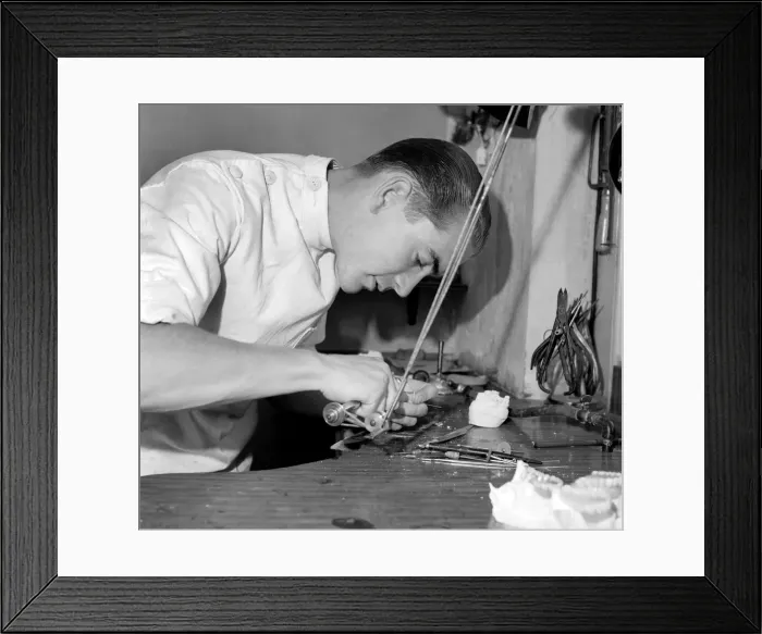 Framed Print : Dental mechanic watch repair. Mr. R. Guy at work in Lab. S. E. I. September 1953 D5549-001 Framed Print : Dental mechanic watch repair. Mr. R. Guy at work in Lab. S. E. I. September 1953 D5549-001