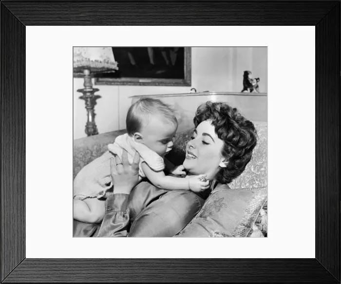 Framed Print : Actress Elizabeth Taylor at home with her baby son Michael. September 1953 D5729