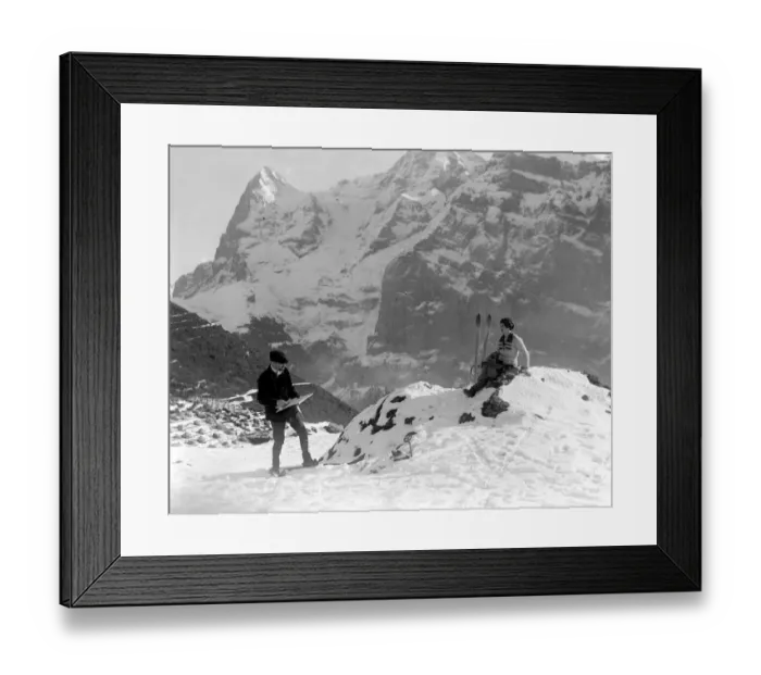 Framed Print : Artist Adrian Allison painting his wife on skis on the mountain slopes at Murren