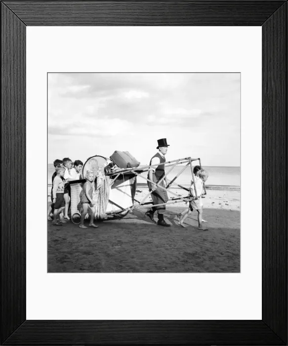 Framed Print : Entertainment: Punch and Judy Show. After putting their pennies in his old top hat