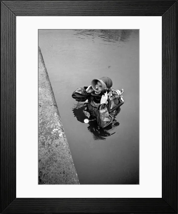 Framed Print : Sylvia Gregg: Girl Frogman'helping to locate missing boy believed to be in