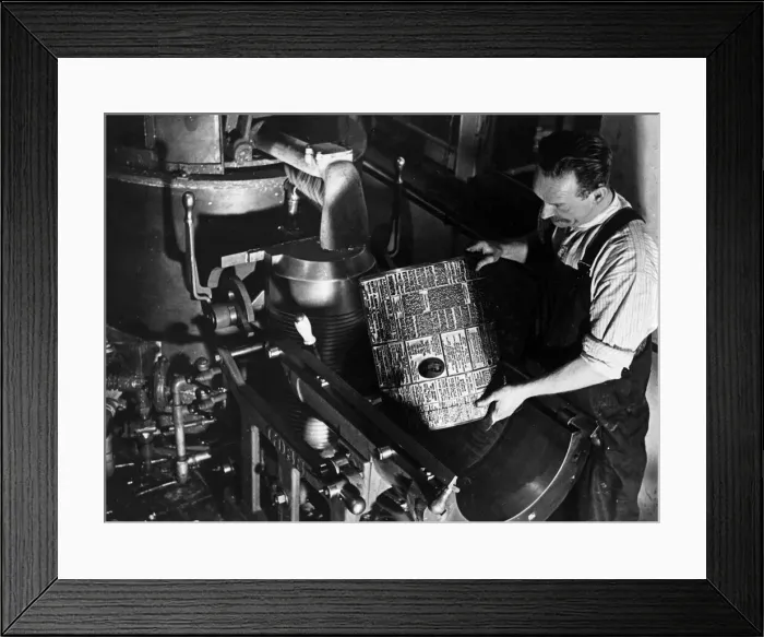 Framed Print : Printers Circa 1950 Printer places a hot metal plate on a printing press Framed Print : Printers Circa 1950 Printer places a hot metal plate on a printing press