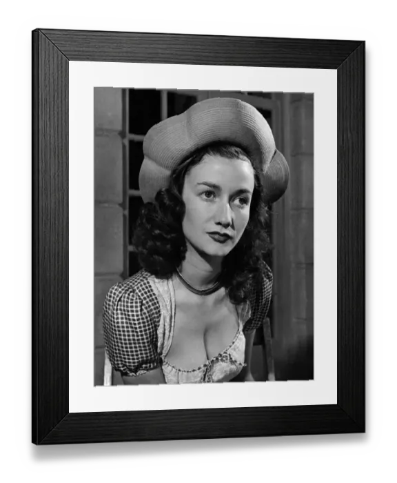 Framed Print : Fashion 1940 s: The gay powder-blue halo hat fits snugly to the crown of the head Framed Print : Fashion 1940 s: The gay powder-blue halo hat fits snugly to the crown of the head