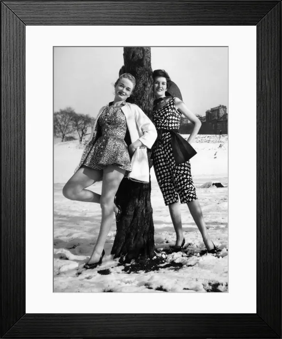 Framed Print : Fashion. Snow everywhere but for these two girls it might as well be spring