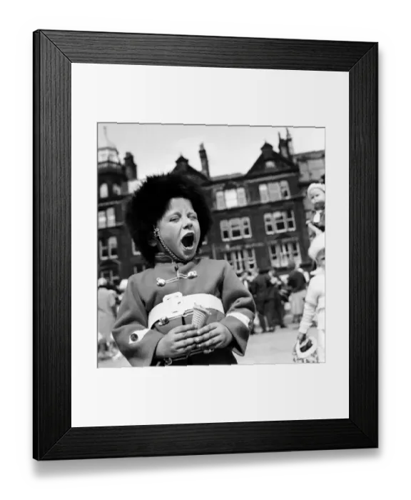 Framed Print : Whit Walks Manchester. June 1960 M4383-012A young boy dressed as a soldier enjoys his Ice