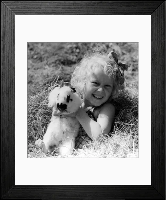 Framed Print : Young girl with pet rabbit Circa 1945 P044458 Framed Print : Young girl with pet rabbit Circa 1945 P044458