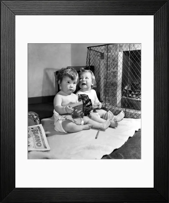 Framed Print : Lyn and Ian Graves disappointed with their present. November 1953 D6988 Framed Print : Lyn and Ian Graves disappointed with their present. November 1953 D6988