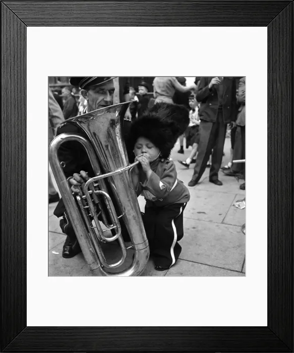 Framed Print : Whit Walks Manchester: Patrick Rooney aged 4 tries his hand at a big blow Framed Print : Whit Walks Manchester: Patrick Rooney aged 4 tries his hand at a big blow