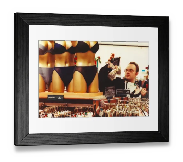 Framed Print : A man struggles to buy his girlfriend the right size underwear Framed Print : A man struggles to buy his girlfriend the right size underwear