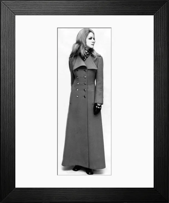 Framed Print : A model wearing a maxi coat