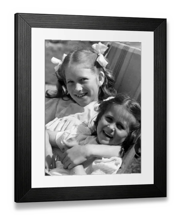 Framed Print : Young girls sitting in deck chair c. 1945 P044482 Framed Print : Young girls sitting in deck chair c. 1945 P044482