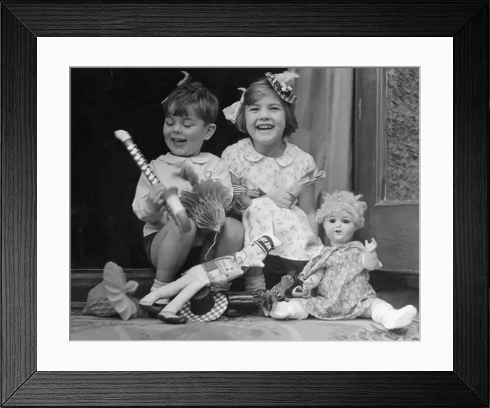 Framed Print : Young boy and girl with toys. c. 1945 P044472 Framed Print : Young boy and girl with toys. c. 1945 P044472