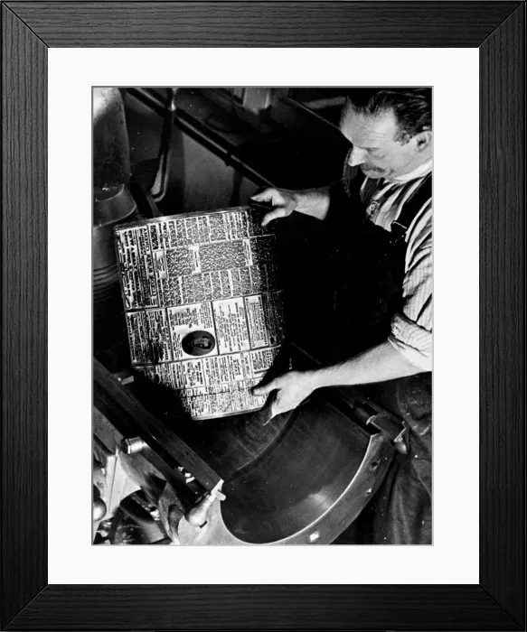 Framed Print : Printers Circa 1950 Printer places a hot metal plate on a printing press Framed Print : Printers Circa 1950 Printer places a hot metal plate on a printing press
