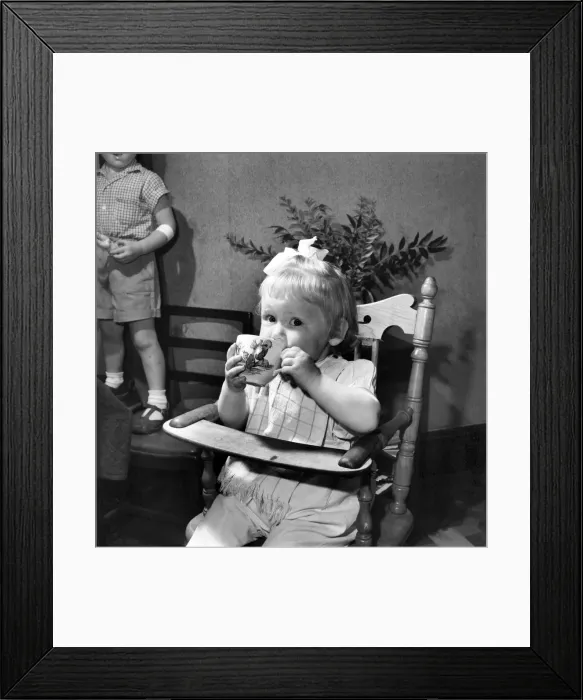 Framed Print : Small girl enjoying a cup of tea. August 1953 D5235 Framed Print : Small girl enjoying a cup of tea. August 1953 D5235