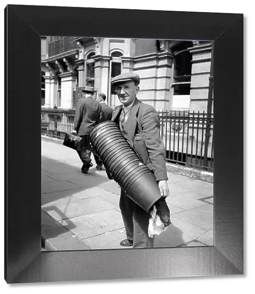 Occupations: Removals: Removal man at the offices of National Insurance seen here holding
