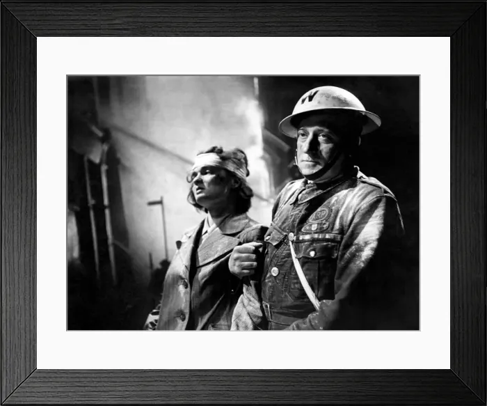 Framed Print : Air Raid Warden Percy Dale helping a victim of the London blitz. Circa October 1940 Framed Print : Air Raid Warden Percy Dale helping a victim of the London blitz. Circa October 1940