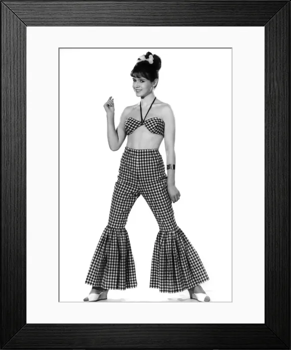 Framed Print : Model Rosemary Bell wearing checkered trousers with flared bottoms Framed Print : Model Rosemary Bell wearing checkered trousers with flared bottoms