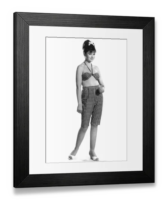 Framed Print : Model Rosemary Bill wearing checkered long shorts and matching top