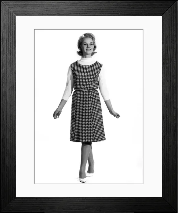 Framed Print : Model wearing long patterned sleveless dress with top underneath Framed Print : Model wearing long patterned sleveless dress with top underneath