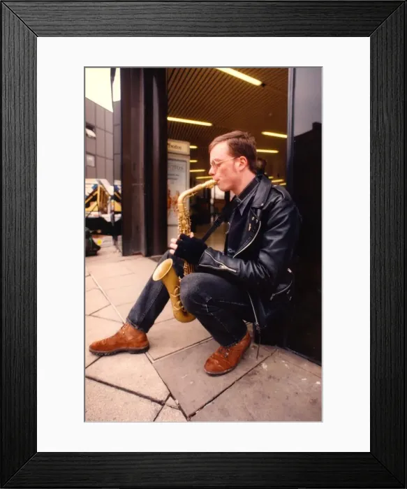 Framed Print : A busker outside the Haymarket Metro station in Newcastle