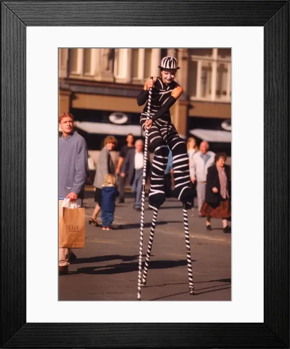 Framed Print : A street entertainer at the Monument in Newcastle Framed Print : A street entertainer at the Monument in Newcastle