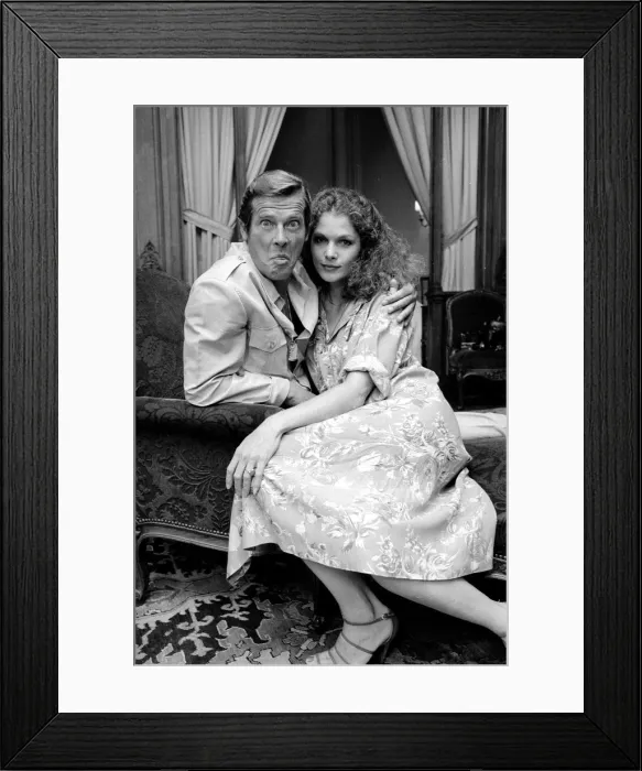 Framed Print : Roger Moore with actress Lois Chiles at a photocall and reception held in Paris to Framed Print : Roger Moore with actress Lois Chiles at a photocall and reception held in Paris to