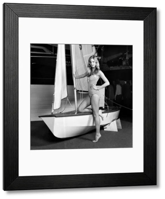 Framed Print : Top glamour model Stephanie McLean posing next to a sailboat January 1975