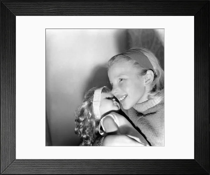Framed Print : Girl playing with toy doll. December 1969 Z12000 Framed Print : Girl playing with toy doll. December 1969 Z12000