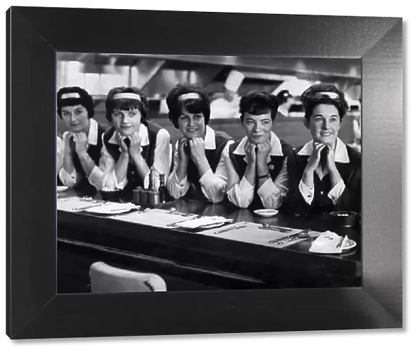 Waitresses at a motorway service station pose for the Camera. November 1963 P009589