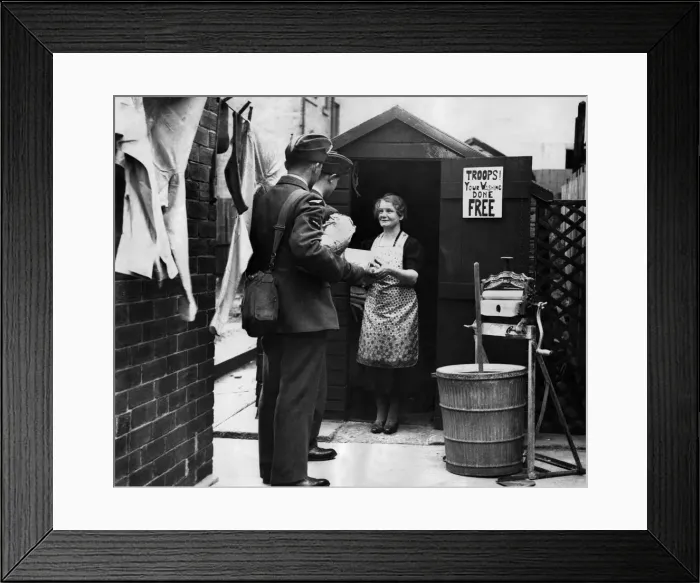 Framed Print : Newcastle housewife takes in laundry from the troops. June 1941 P012299 Framed Print : Newcastle housewife takes in laundry from the troops. June 1941 P012299