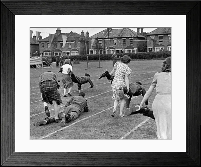 Framed Print : Munition workers taking part in the Wheelbarrow race during their sports day Framed Print : Munition workers taking part in the Wheelbarrow race during their sports day