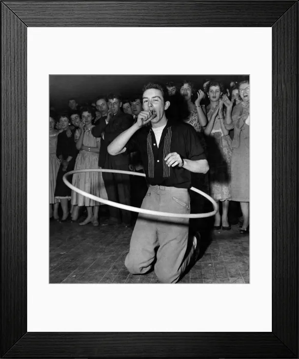 Framed Print : A youth yawns as her competes in a Hula Hoop marathon. October 1958 P012316 Framed Print : A youth yawns as her competes in a Hula Hoop marathon. October 1958 P012316