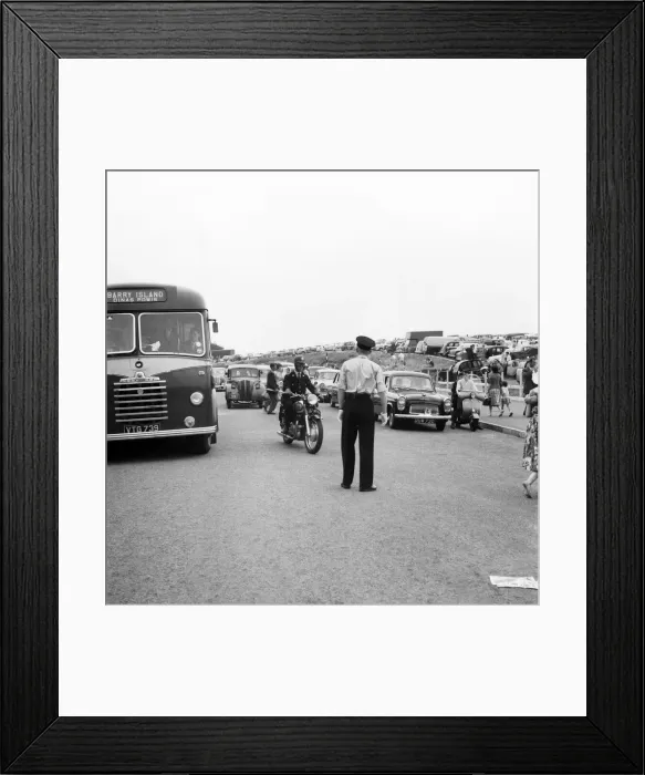 Framed Print : Holiday Crowds at Barry Island: Two Barry policeman control the dangerous crossing point Framed Print : Holiday Crowds at Barry Island: Two Barry policeman control the dangerous crossing point