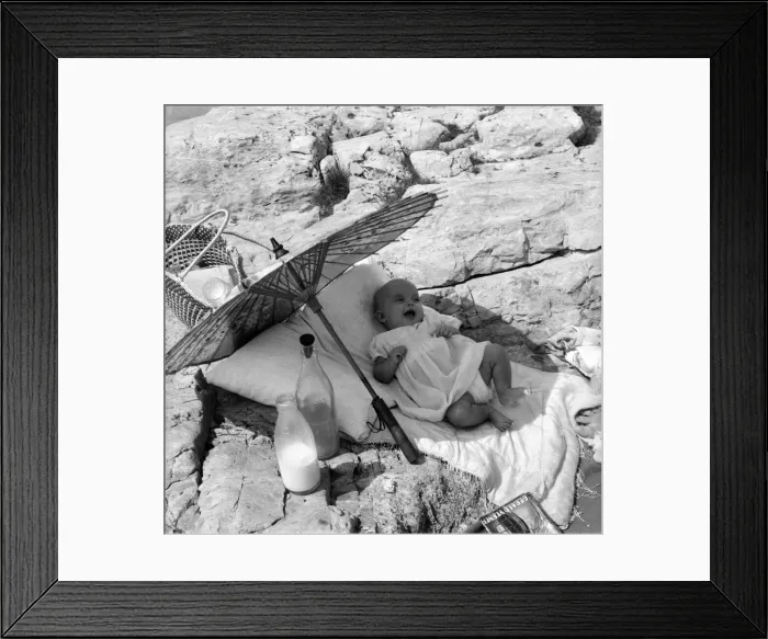 Framed Print : Baby under Sunshade beach pix. The happy baby is 4 months old Beverley Lovelock