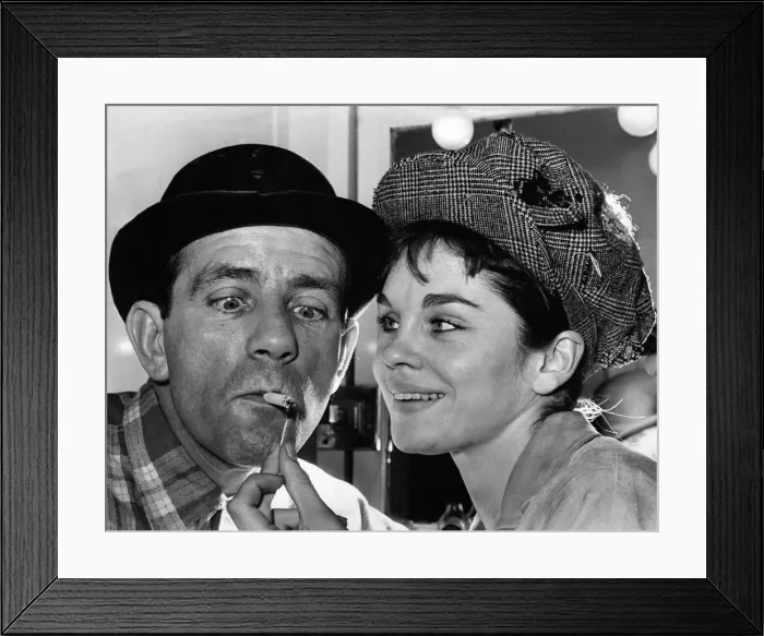 Framed Print : Norman Wisdom gets a light from co-star Sally Smith. August 1964 P009831 Framed Print : Norman Wisdom gets a light from co-star Sally Smith. August 1964 P009831
