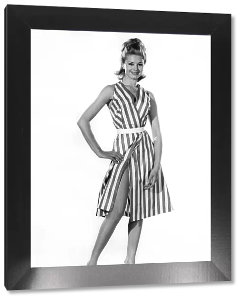 Model Margaret Lorraine wearing striped sleeveless dress with bellt