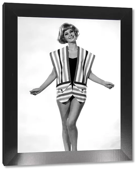 Model Dawn Adams wearing sleeveless striped top. August 1962 P008952