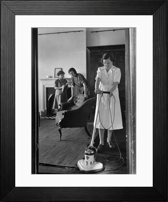 Framed Print : The National Institute of Houseworkers. Electric floor polisher being demonstrated Framed Print : The National Institute of Houseworkers. Electric floor polisher being demonstrated