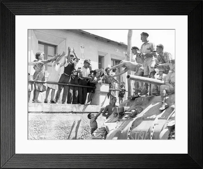 Framed Print : British soldiers greeted by local villagers during the Allied invasion Framed Print : British soldiers greeted by local villagers during the Allied invasion
