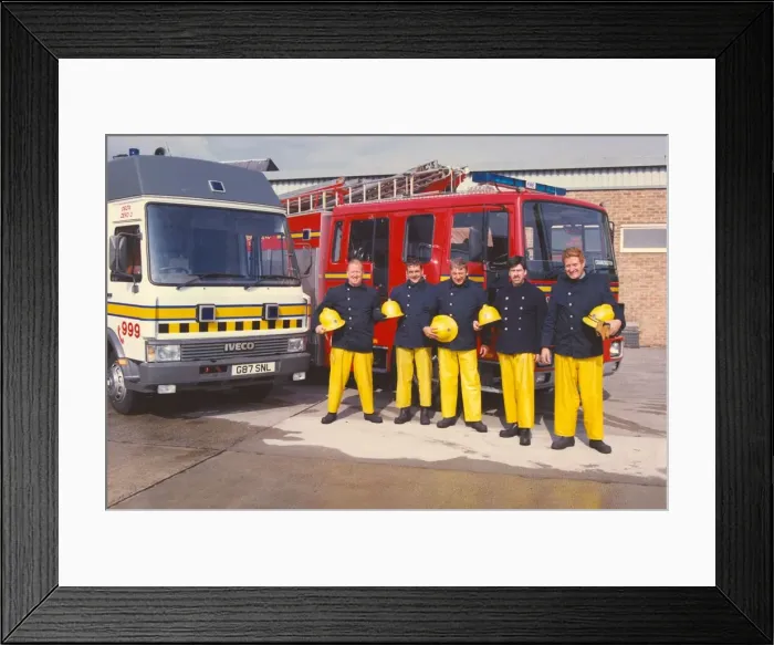 Framed Print : A group of firefighters ready for action
