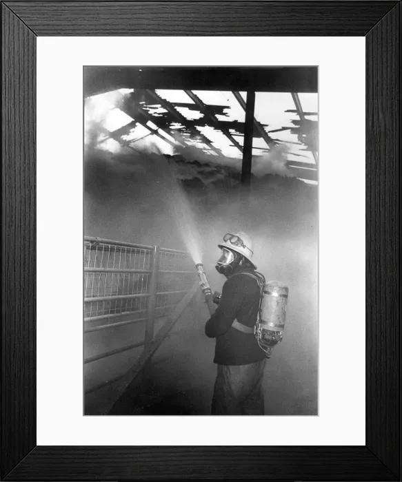 Framed Print : A firefighter fights the flames at a blaze at Hexham Auction Mart Framed Print : A firefighter fights the flames at a blaze at Hexham Auction Mart