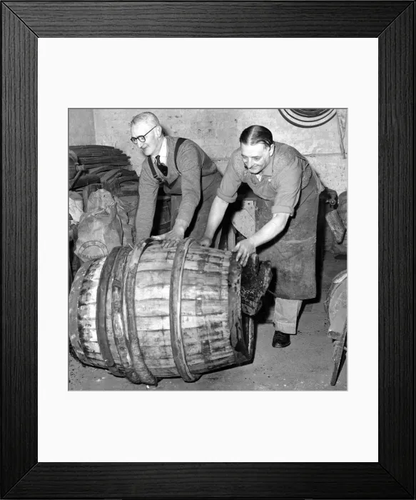 Framed Print : Coppers pushing a finished barrel made by an apprentice to mark the end of his five year Framed Print : Coppers pushing a finished barrel made by an apprentice to mark the end of his five year