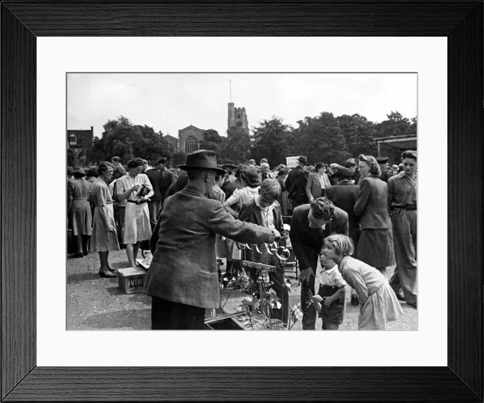 Framed Print : Busy scenes at a local market in Maidstone, Kent. A father with his children looking